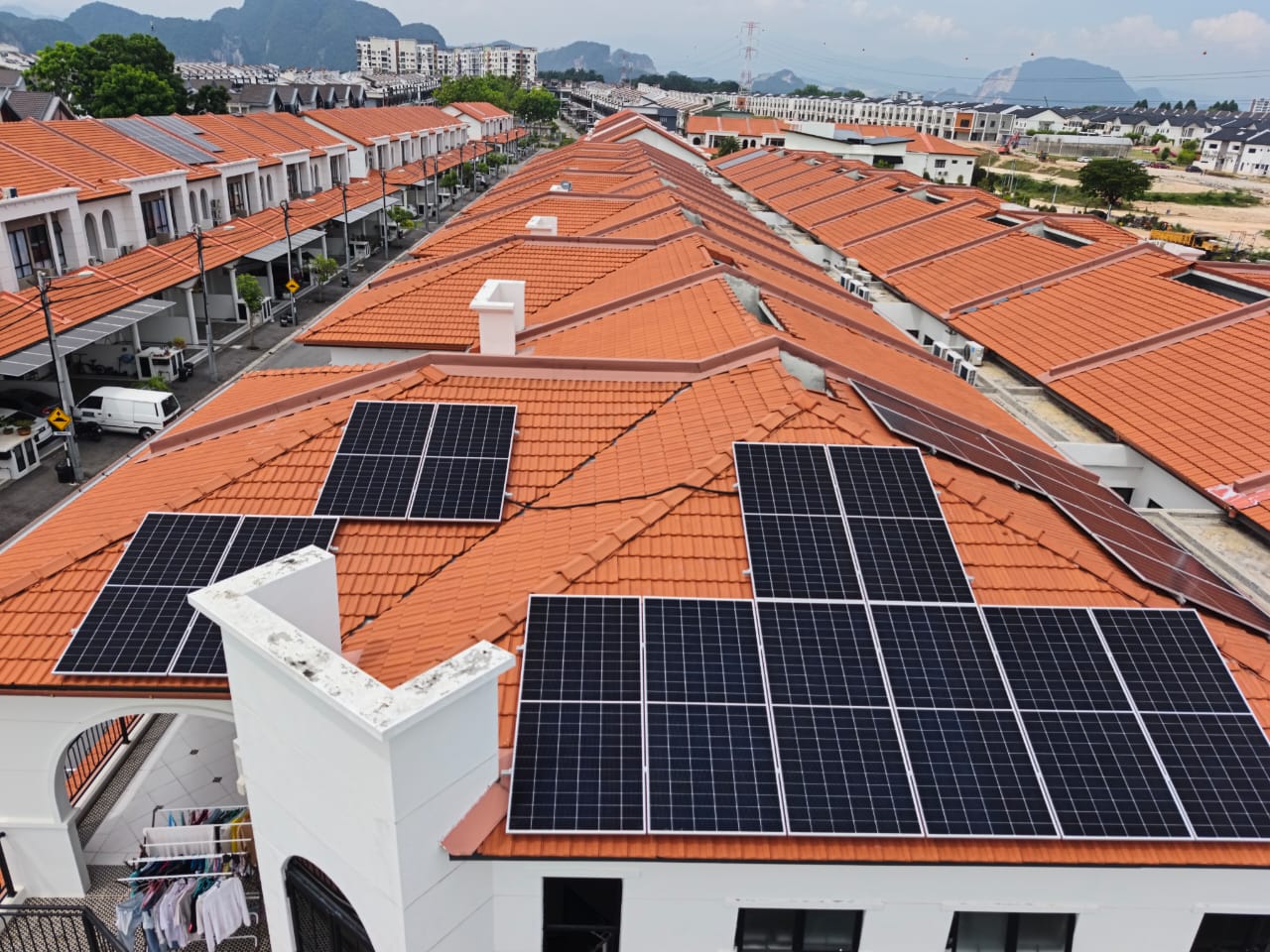 Residential solar panel installation on a terraced Malaysian home